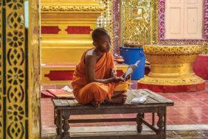 Young Monk reading a book in a temple